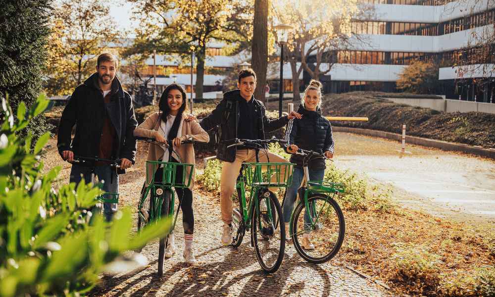 Friends riding bikes outside.