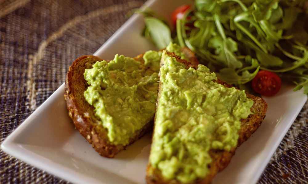 Avocado toast on plate.