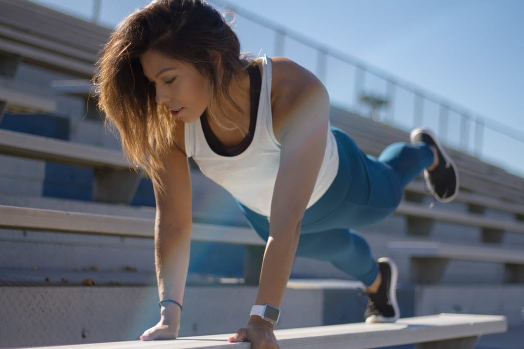 Woman Doing Push ups on Stairs