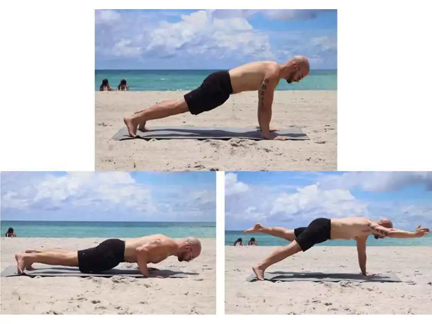 a man doing push ups on a beach