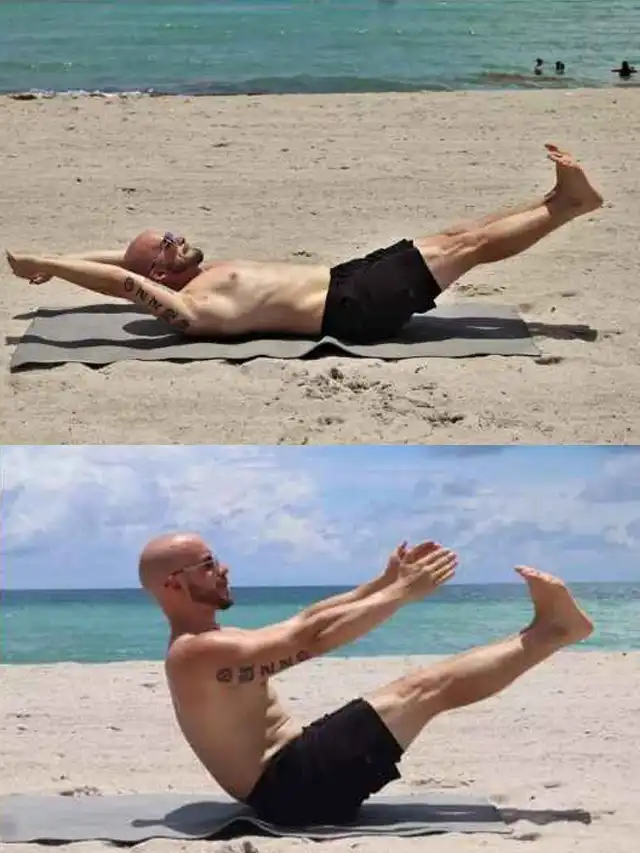 a man doing a sit up on a mat on a beach