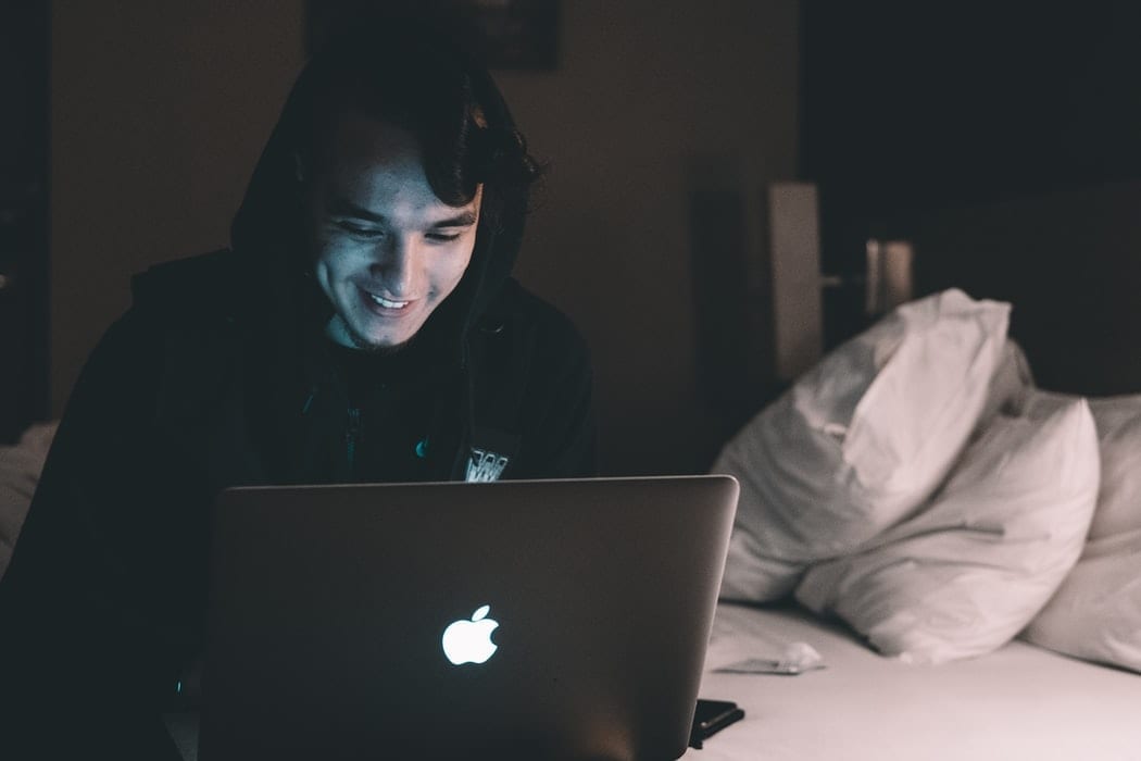 Young Man Working on Laptop