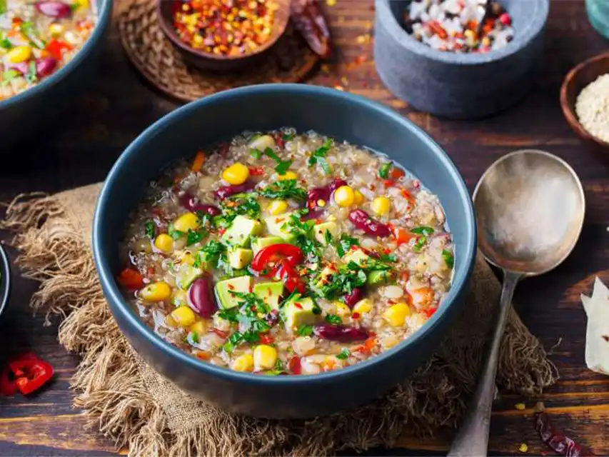 a bowl of food with spoon and spoon