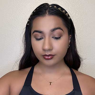 Girl with deeper eyeshadow shade on eyelids.