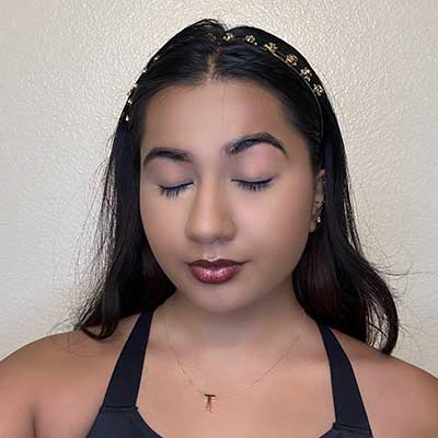 Girl with primer on her eyelids.