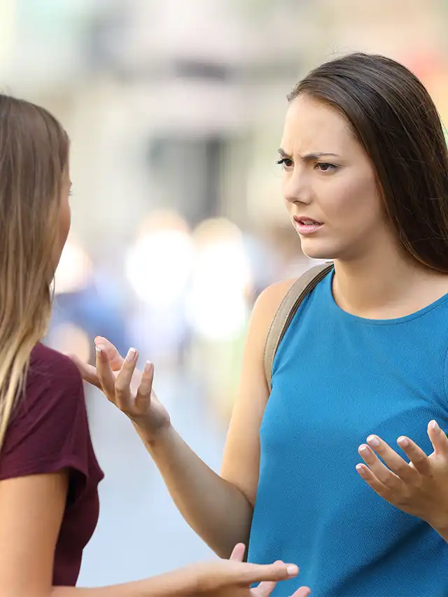 a woman talking to another woman