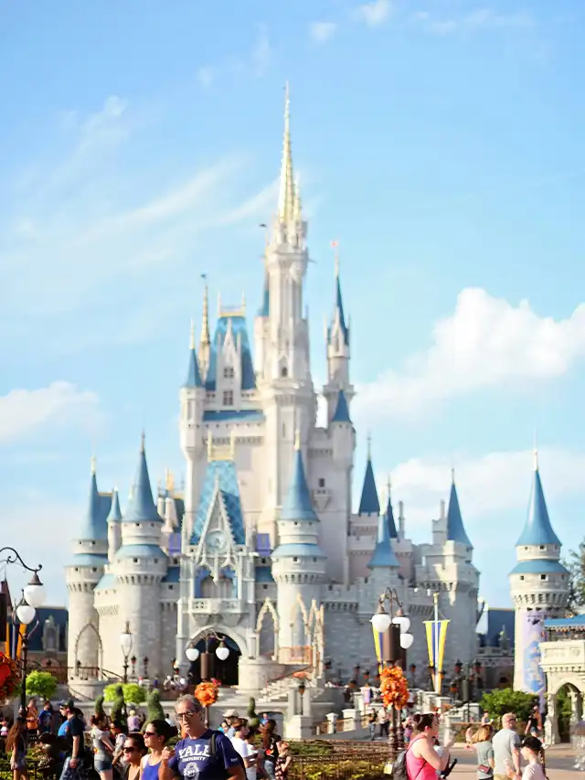 a castle with people walking in front of it