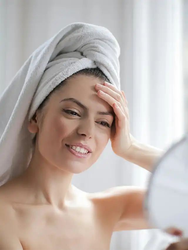 a woman with a towel on her head