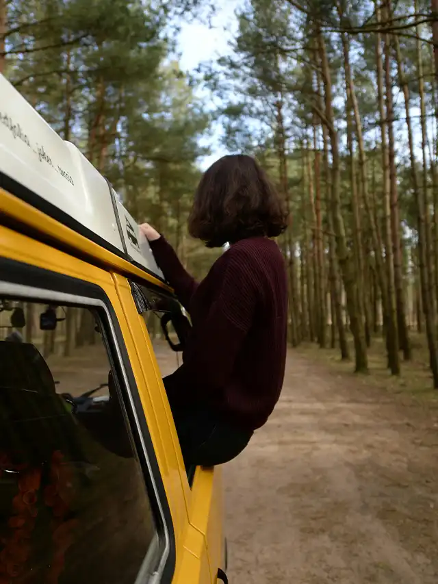 a woman sitting in a car