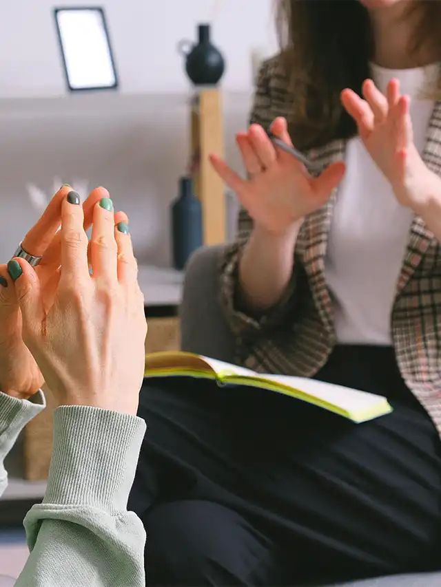 a group of people clapping hands